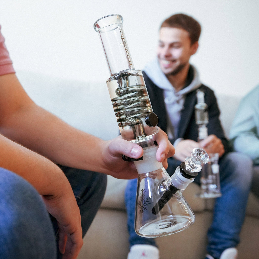 Person using Freeze Pipe Beaker Bong with detachable glycerin coil for smooth, ice-cold smok